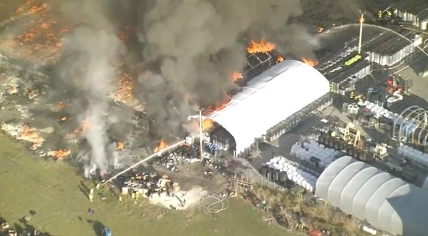 Hundreds Of Plastic Containers Burn In A Massive Fire At Plant Nursery In Florida